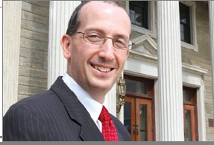 Picutre of Gary Port standing at the Nassau County Court